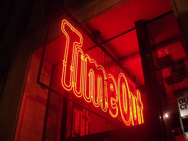 Red neon Time Out sign shown in a frame